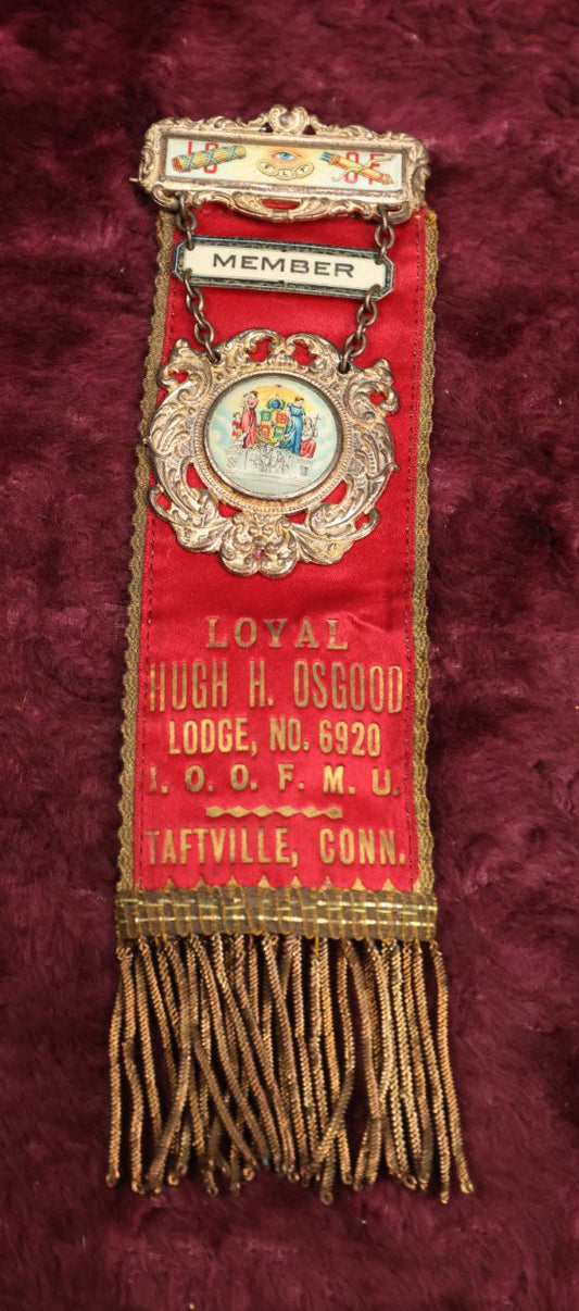 Lot 084 - Antique Odd Fellows Ribbon And Badge, Loyal Hugh H. Osgood Lodge No. 6920, I.O.O.F.M.U., Independent Order Of Odd Fellows, Manchester Unity, Taftville, Connecticut, Made By Whitehead And Hoag, Co.