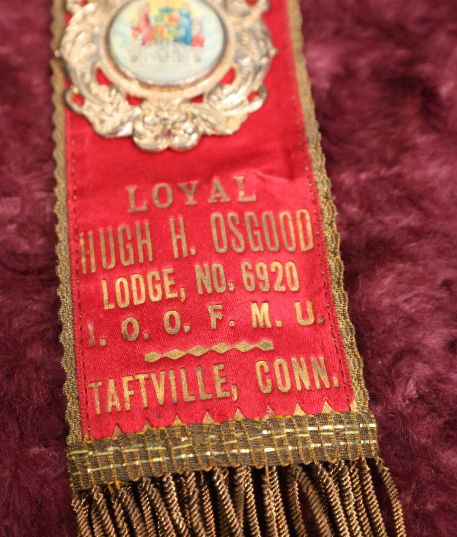 Lot 084 - Antique Odd Fellows Ribbon And Badge, Loyal Hugh H. Osgood Lodge No. 6920, I.O.O.F.M.U., Independent Order Of Odd Fellows, Manchester Unity, Taftville, Connecticut, Made By Whitehead And Hoag, Co.