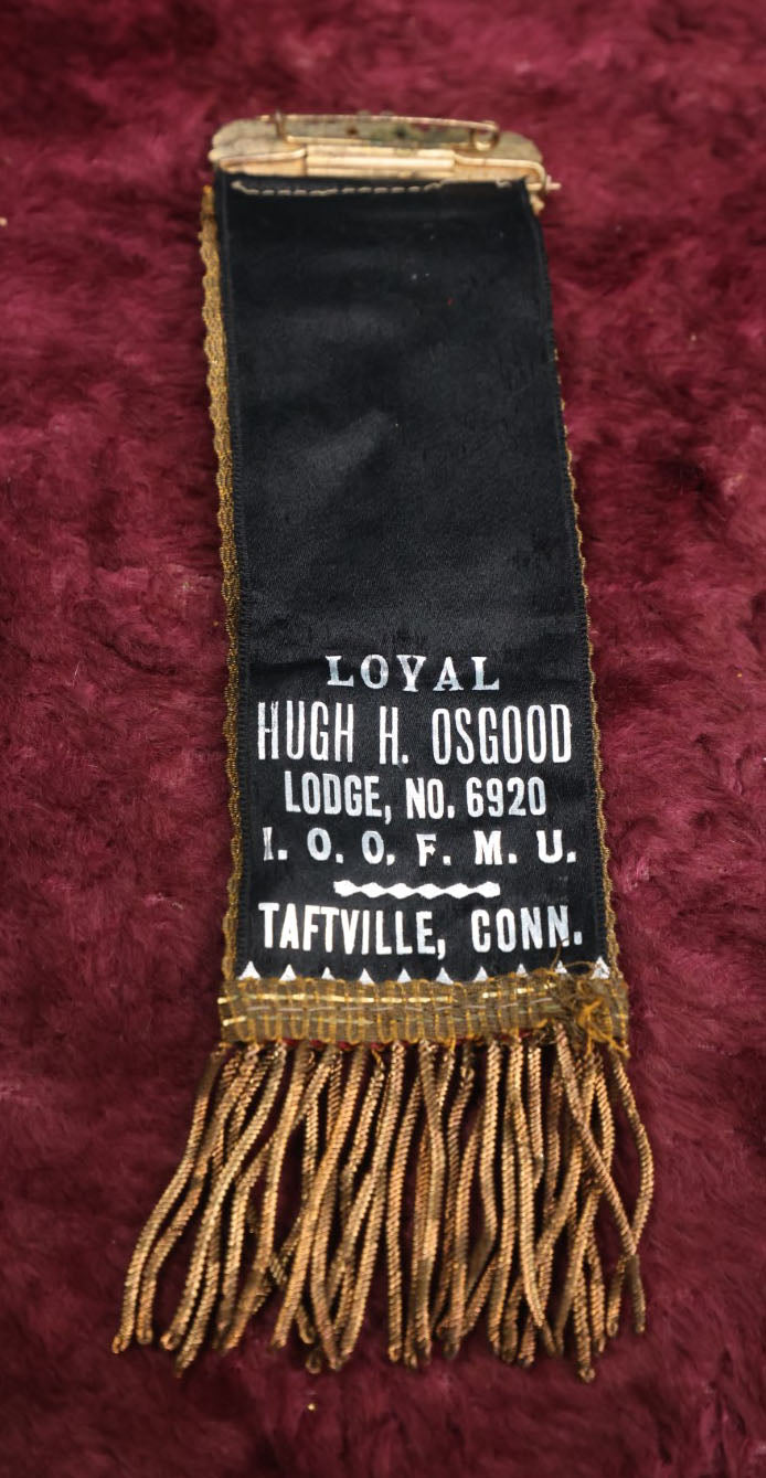 Lot 084 - Antique Odd Fellows Ribbon And Badge, Loyal Hugh H. Osgood Lodge No. 6920, I.O.O.F.M.U., Independent Order Of Odd Fellows, Manchester Unity, Taftville, Connecticut, Made By Whitehead And Hoag, Co.