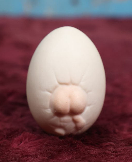 Lot 087 - Antique Bisque Porcelain "Birthing Egg," Baby Breaking Out Of Egg, Butt On Back, Hole In Bottom, Likely German