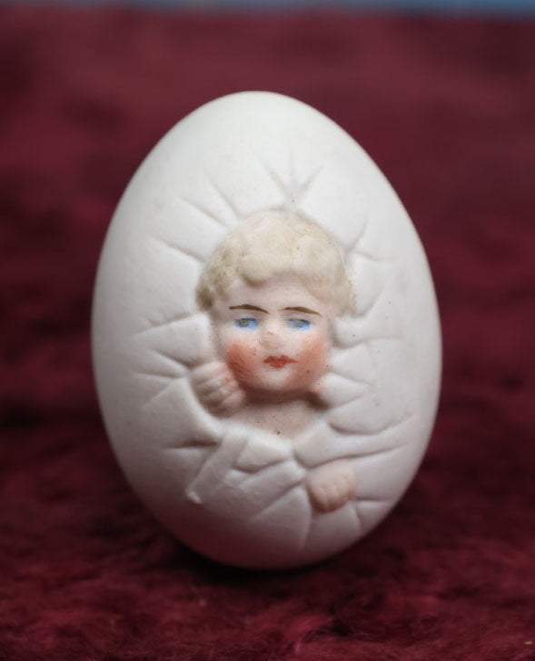 Lot 088 - Antique Bisque Porcelain "Birthing Egg," Baby Breaking Out Of Egg, Butt On Back, No Hole In Bottom, Likely German