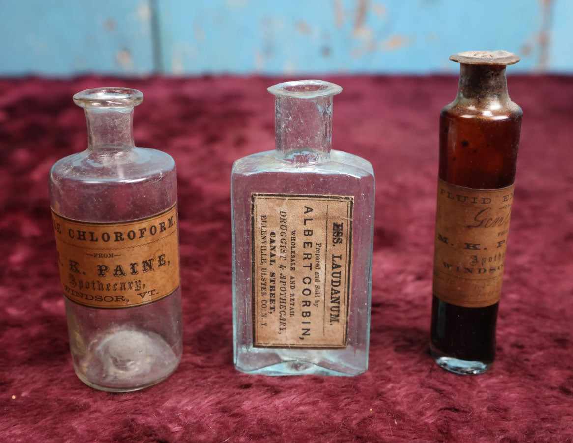 Lot 089 - Grouping Of Three Antique Hand Blown Glass Pontiled Bottles With Apothecary Labels Including Chloroform, Laudanum, And Gentian, Labels From Vermont And New York