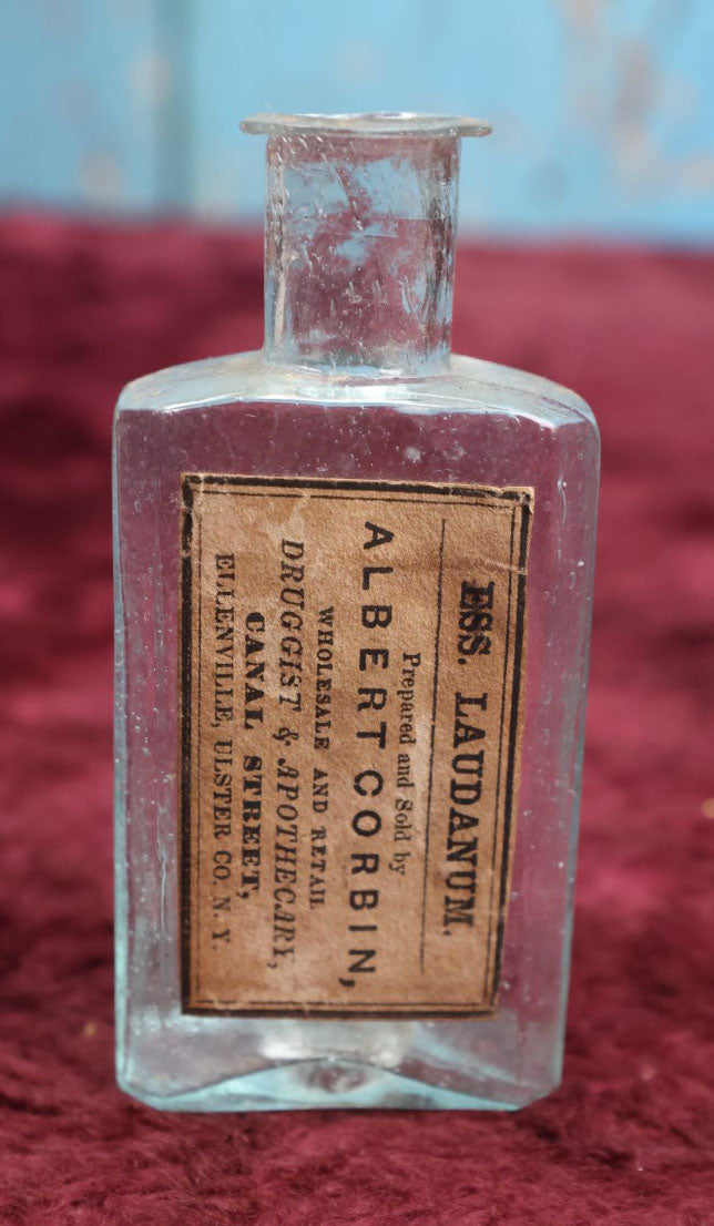 Lot 089 - Grouping Of Three Antique Hand Blown Glass Pontiled Bottles With Apothecary Labels Including Chloroform, Laudanum, And Gentian, Labels From Vermont And New York