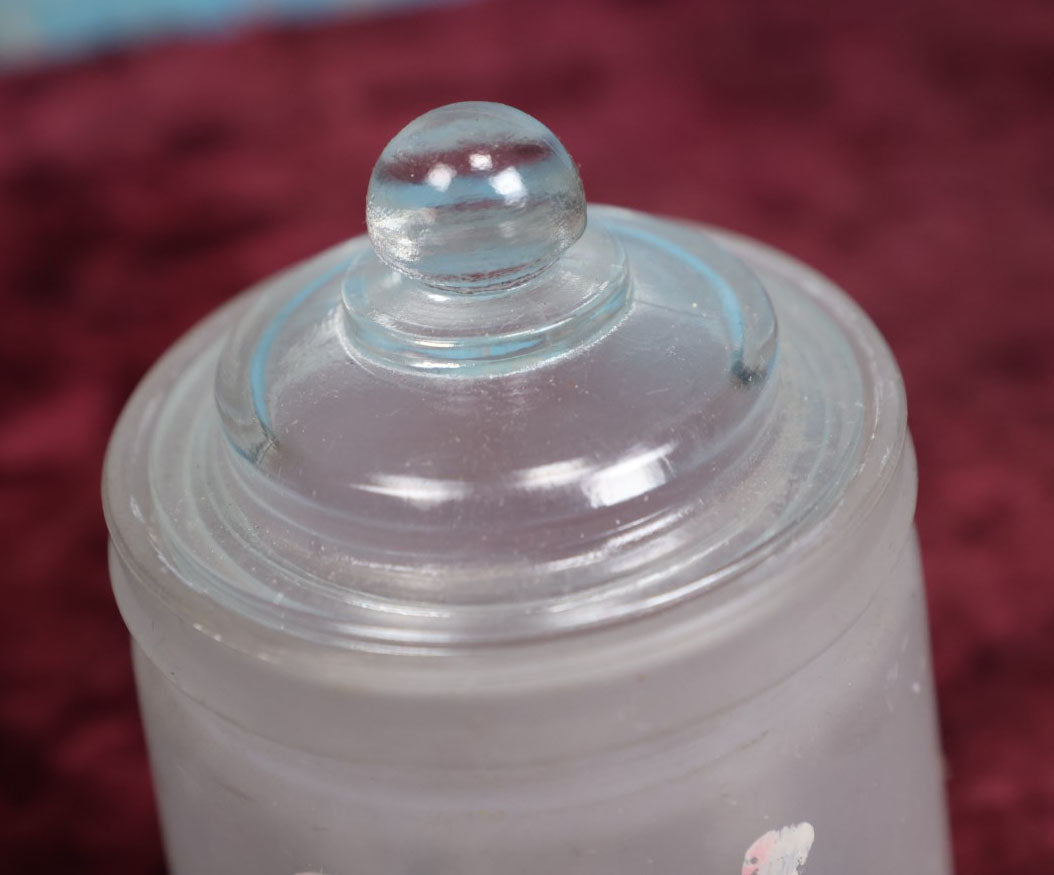 Lot 091 - Antique Hazel Atlas Frosted Glass Hand Painted "Nipples" Jar, Likely Used For Holding Baby Bottle Nipples, With Lid, Note Losses To Paint