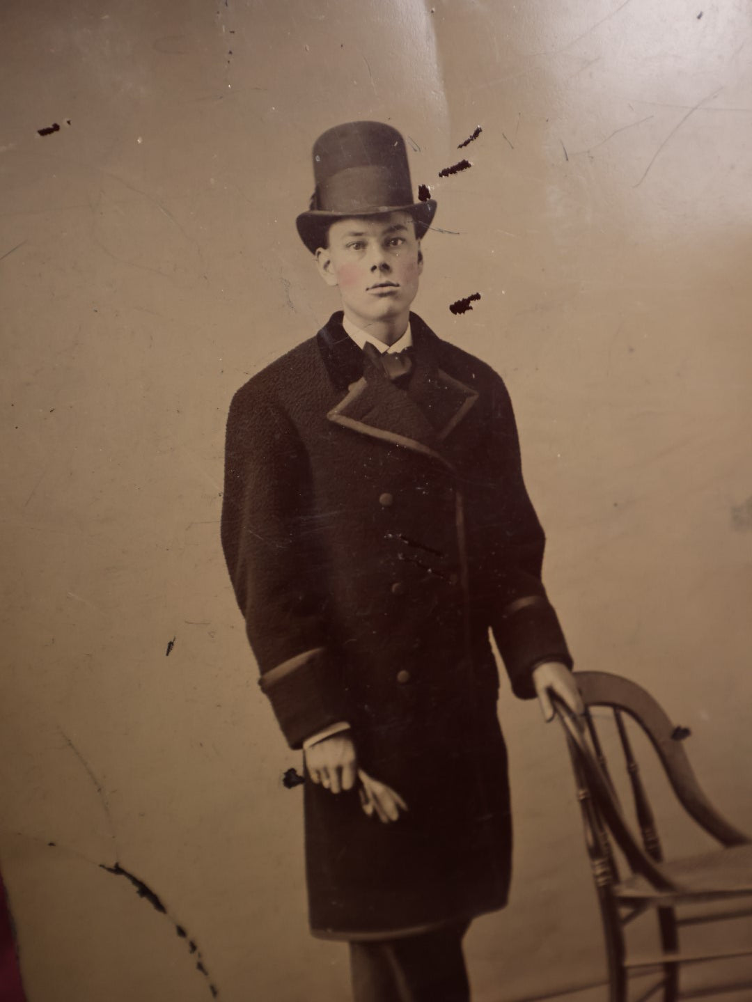 Lot 110 - Antique Tintype Of Young Boy In Long Peacoat, Tall Bowler Hat, Approximately 1/4 Plate