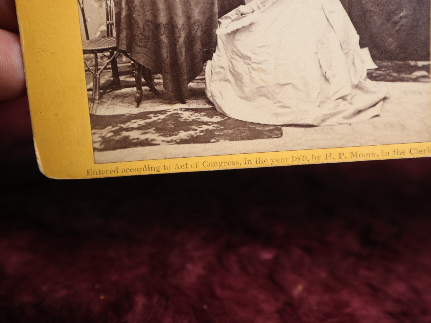 Lot 111 - Antique Spirit Photography Stereo Card, Woman At Table Looking At Photo Album With Spirit Behind Her, Dated 1869 By H.P. Moore, New Hampshire 