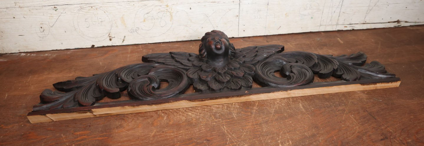 Lot 001 - Antique Salvaged Carved Wooden Furniture Fragment With Winged Cherub - 32.75" Long