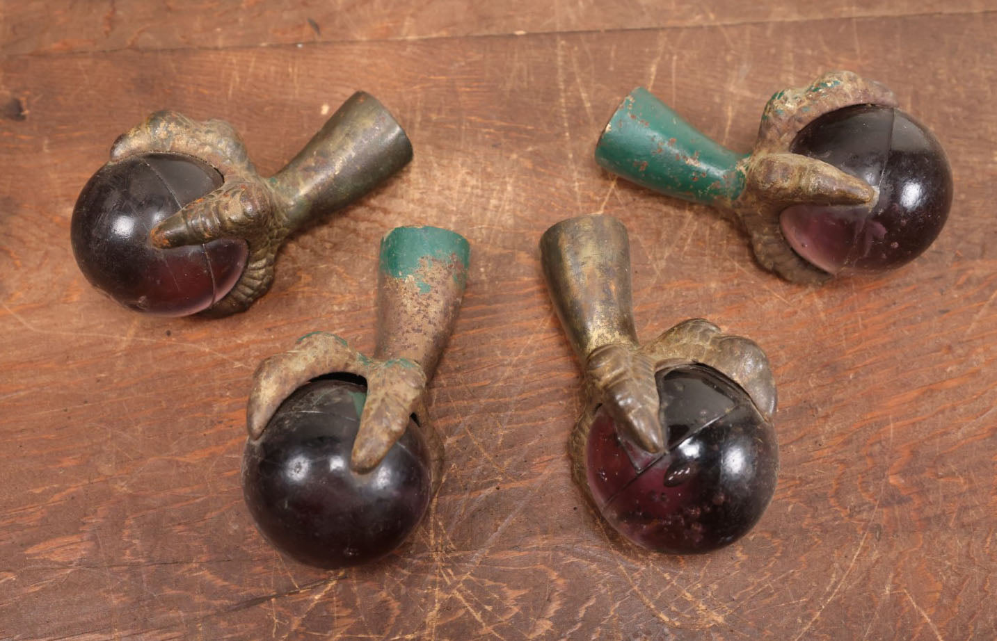 Lot 008 - Grouping Of Four Large Size Cast Iron And Glass Ball And Claw Furniture Feet With Purple Glass Balls