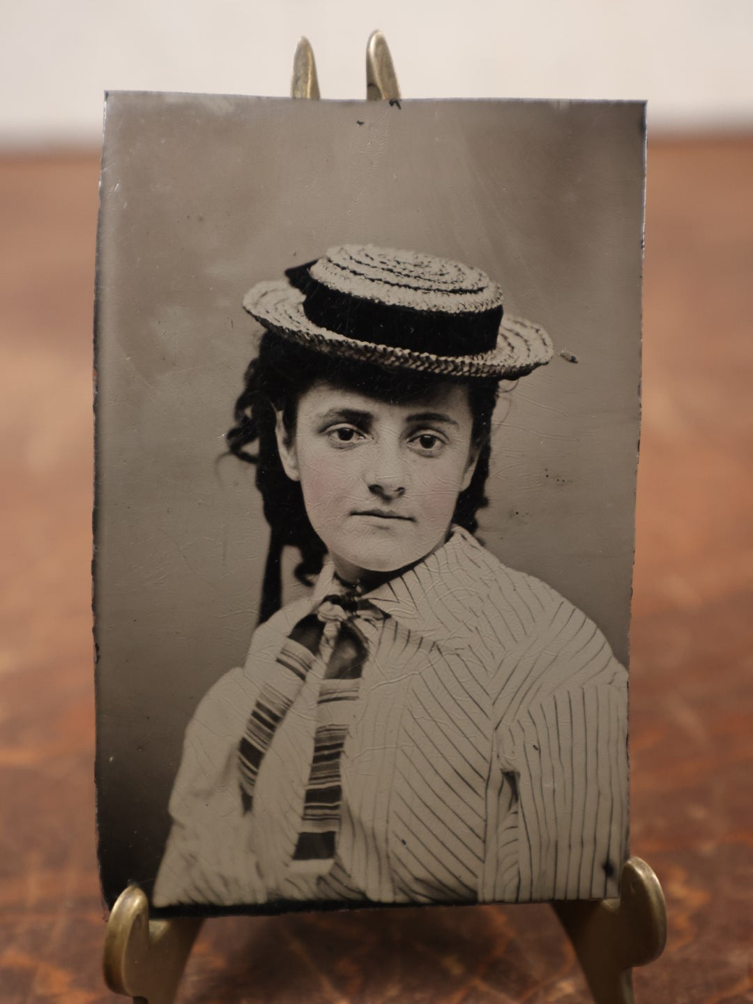 Lot 181 - Single Tintype Photo, Young Woman In Hat With Black Band, Striped Tie