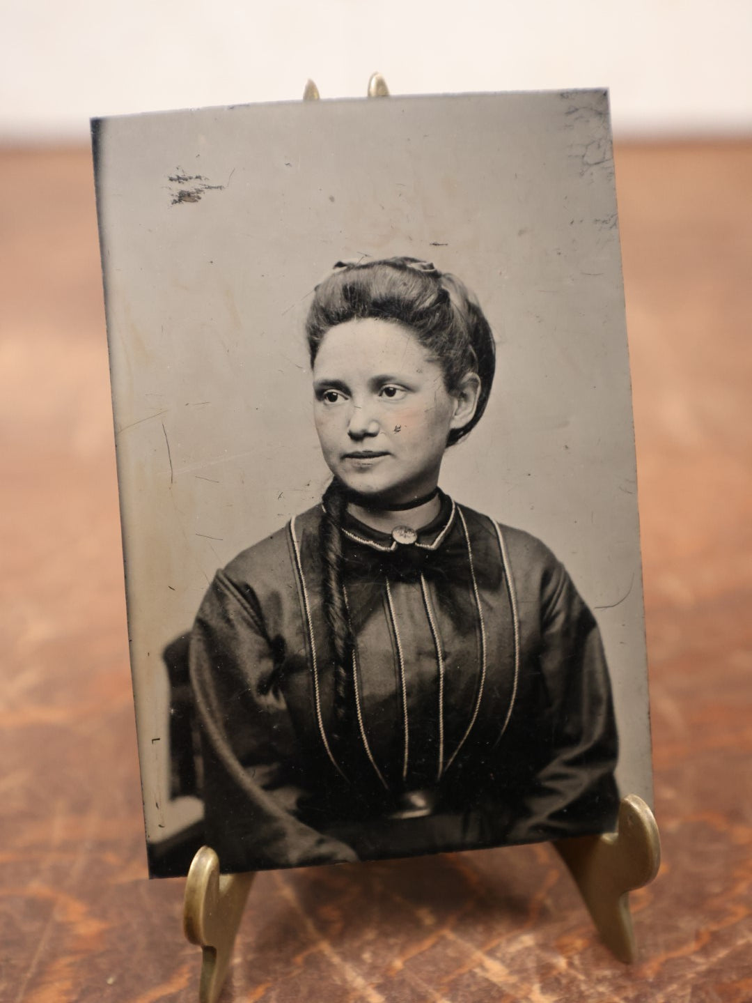 Lot 182 - Single Tintype Photo, Young Woman Looking To Left, Brooch On Collar, Hair Hanging In Ponytail On Left