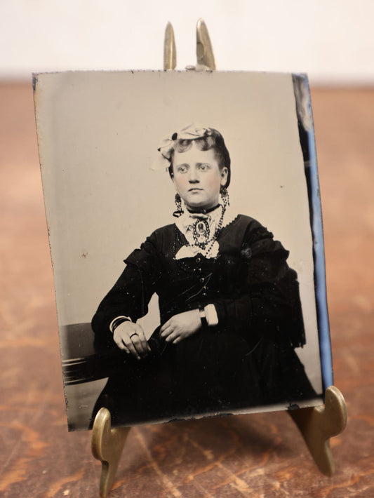 Lot 183 - Single Tintype Photo, Young Woman With Bow In Hair, Many Necklaces, Brooch, Ring