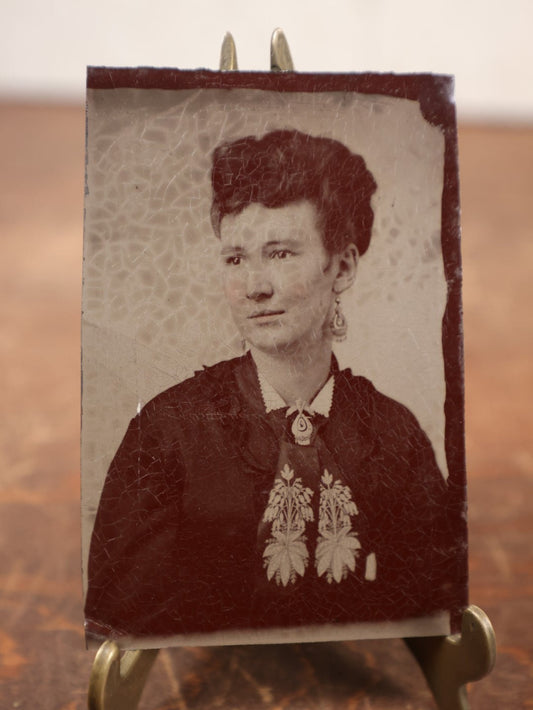 Lot 186 - Single Tintype Photo, Young Woman With Earrings, Decorated Tie With Floral Design