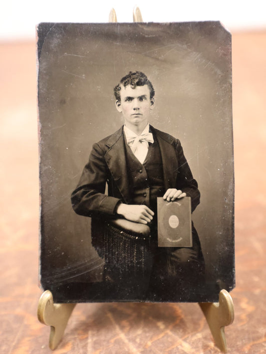 Lot 188 - Single Tintype Photo, Young Man Holding Book That Says "Glory, Immortal Life"