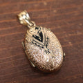 Lot 023 - Antique Brass And Enamel Locket With Small Hair Keepsake Memento Inside