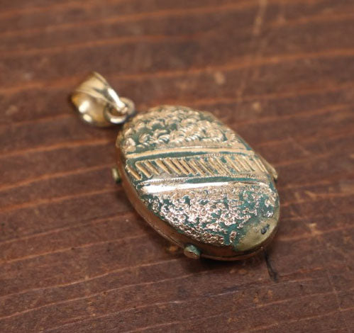 Lot 023 - Antique Brass And Enamel Locket With Small Hair Keepsake Memento Inside