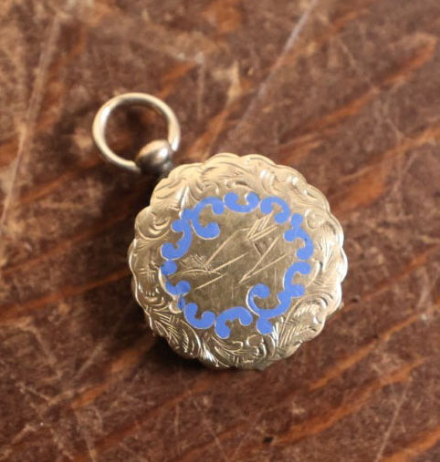 Lot 024 - Antique Brass And Blue Enamel Locket Containing A Miniature Daguerreotype Of A Pretty Young Woman