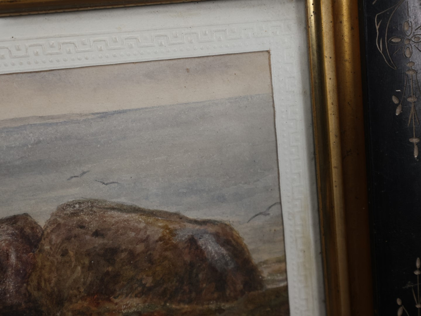 Lot 029 - Antique Watercolor Seascape Painting Of Rocks On Shore, Seagulls, Sky, In Antique Ebony Etched Wood Eastlake Frame