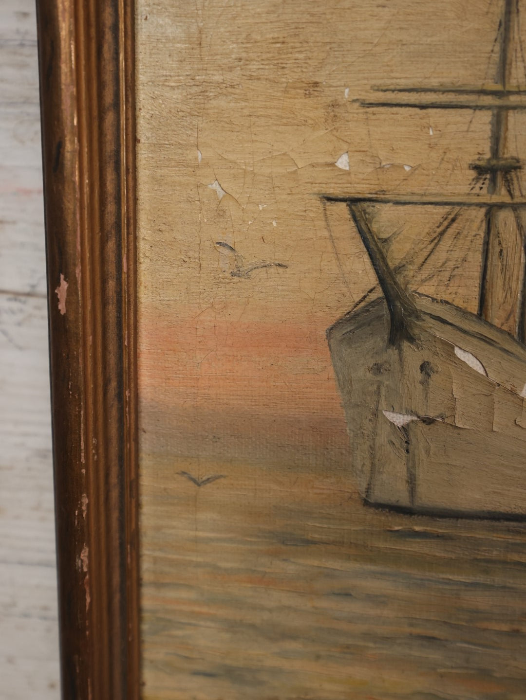 Lot 030 - Antique Oil On Canvas Painting Of A Tall Ship With Colorful Sunset Sky, Seagulls, Note Losses To Paint