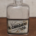 Lot 056 - Antique Apothecary Bottle With Glass Label, Tincture Of Cardamom, Note Crack In Label, Includes Stopper