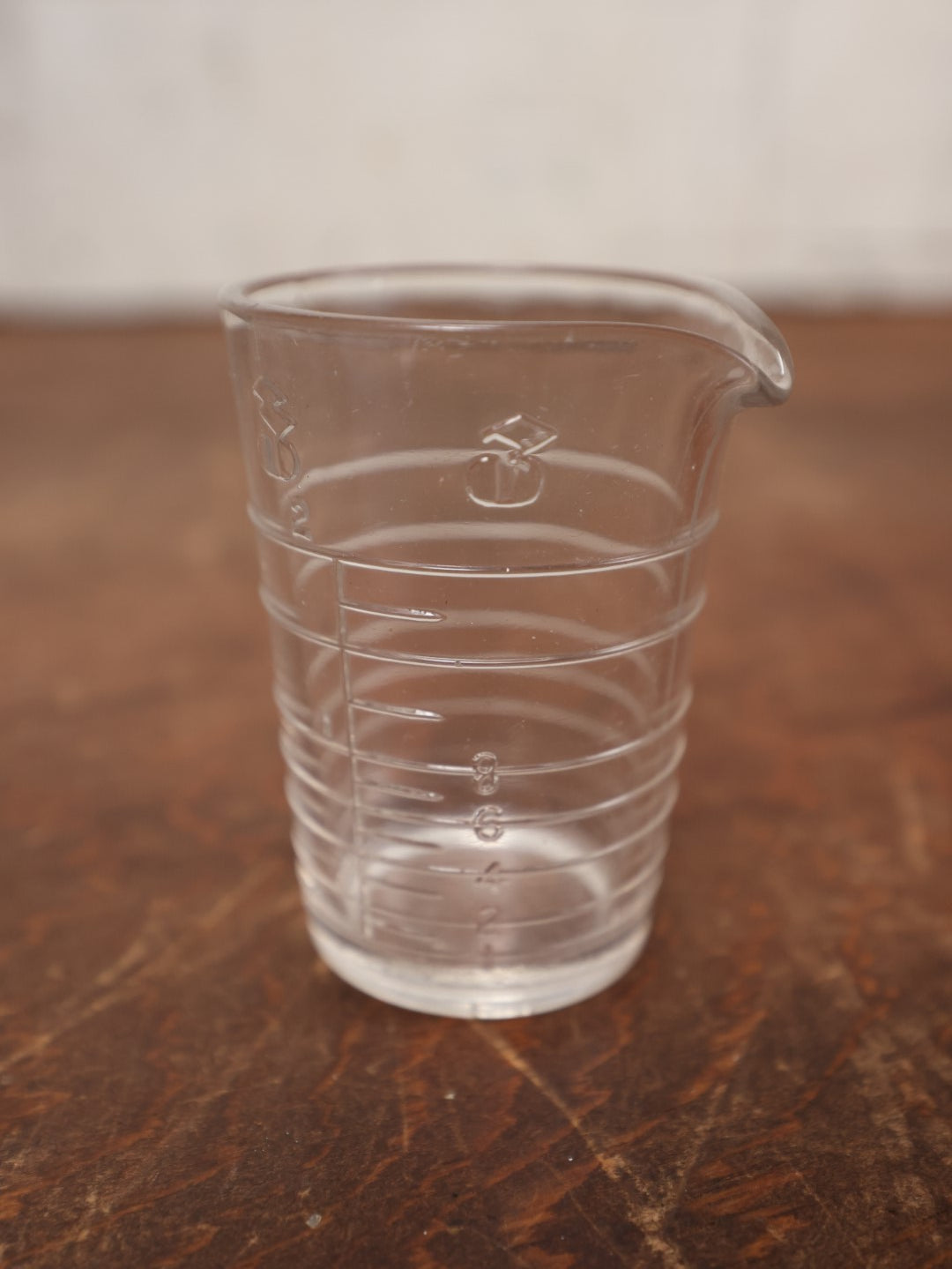 Lot 063 - Vintage 3 Ounce Glass Medicine Measuring Cup With Embossed Hash Marks