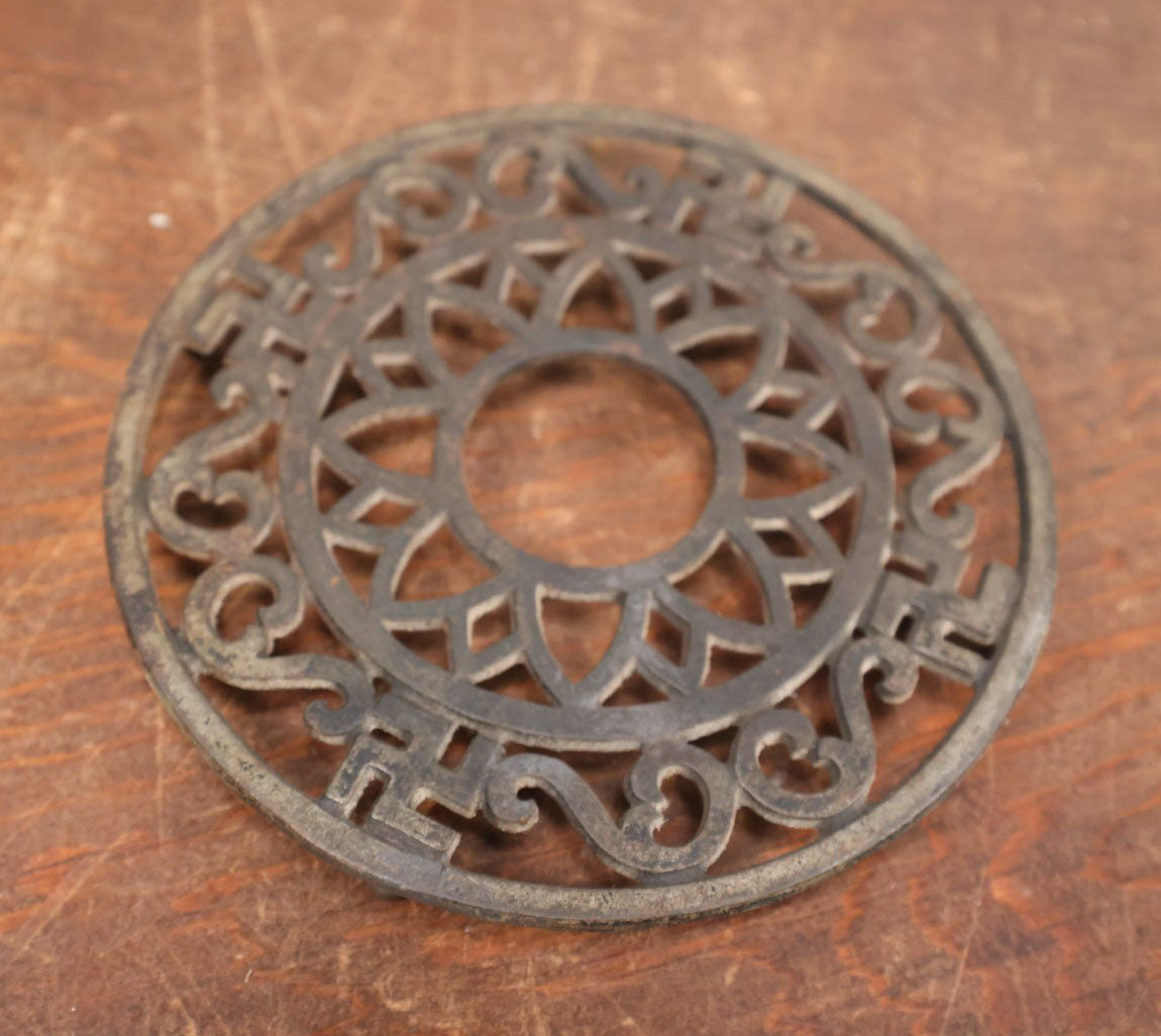 Lot 079 - Antique Round Cast Iron Trivet With "Whirling Logs" Swastika Motif, A Pre-Nazi Symbol Of Good Luck