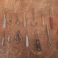 Lot 097 - Grouping Of Sixteen Various Antique Metal Shoe Button Hooks