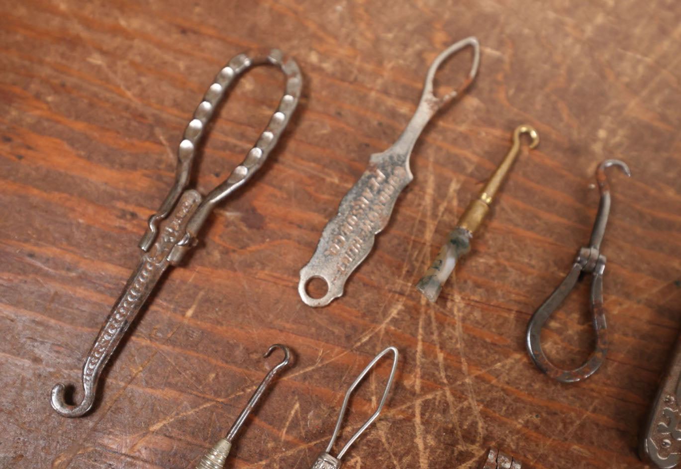 Lot 097 - Grouping Of Sixteen Various Antique Metal Shoe Button Hooks