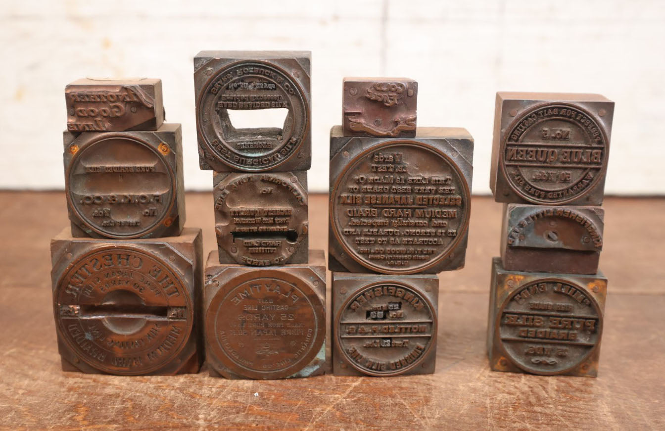 Lot 101 - Grouping Of Twelve Antique Fishing Line Advertising Print Block Letterpress, Various Brands Including Blue Queen, Playtime, Kingfisher, Etc.