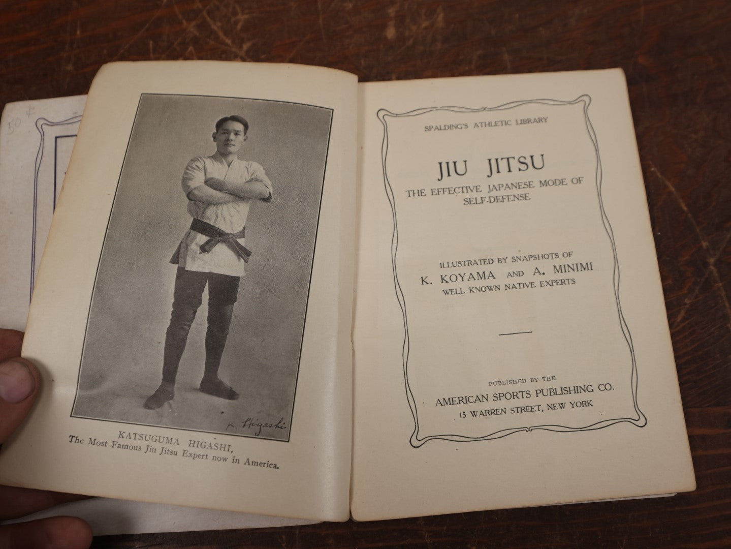 Lot 122 - Spalding's Athletic Library, "Jiu Jitsu: The Effective Japanese Mode Of Self Defense," With Photos Of K. Koyama And A. Minimi, Copyright 1905, American Sports Publishing Co., New York, 