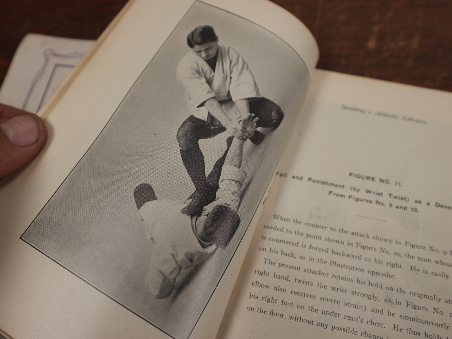 Lot 122 - Spalding's Athletic Library, "Jiu Jitsu: The Effective Japanese Mode Of Self Defense," With Photos Of K. Koyama And A. Minimi, Copyright 1905, American Sports Publishing Co., New York, 