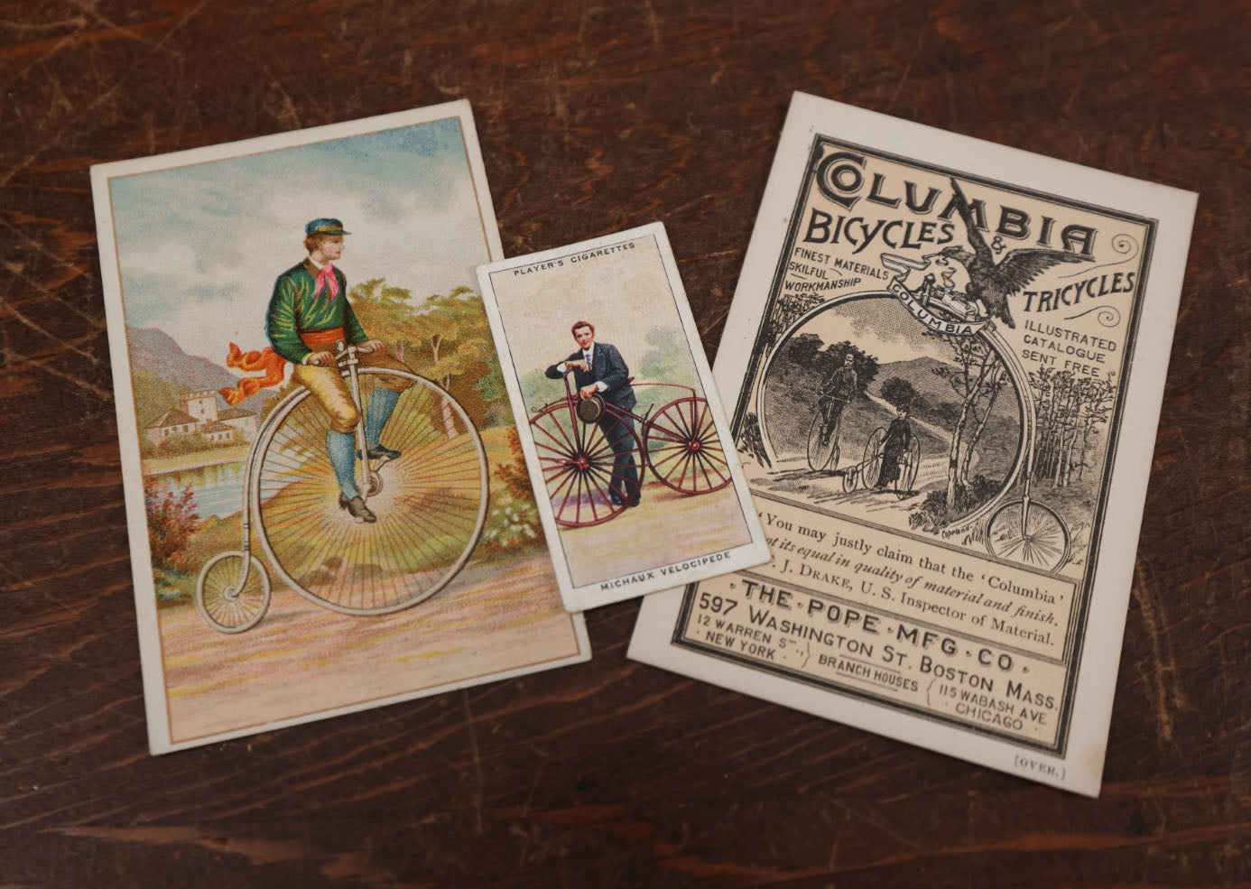 Lot 171 - Grouping Of Three Pieces Of Antique Bicycle Ephemera Including Columbia Bicycles, Player's Cigarette Card, And More