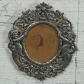 Lot 012 - Diminutive Antique Cast Silvertone Metal Frame With Cherubs On Sides, From Florence, Italy, By George W. Child, Containing An Identified Photo Of Lora F. Child And Donald Pratt, Circa 1895