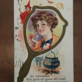 Lot 029 - Antique Embossed Halloween Postcard, Woman In Mirror With Apple, Red Witch, Black Cat, Good Luck Cauldron, Postmarked 1919, Writing On Back, Series 248D