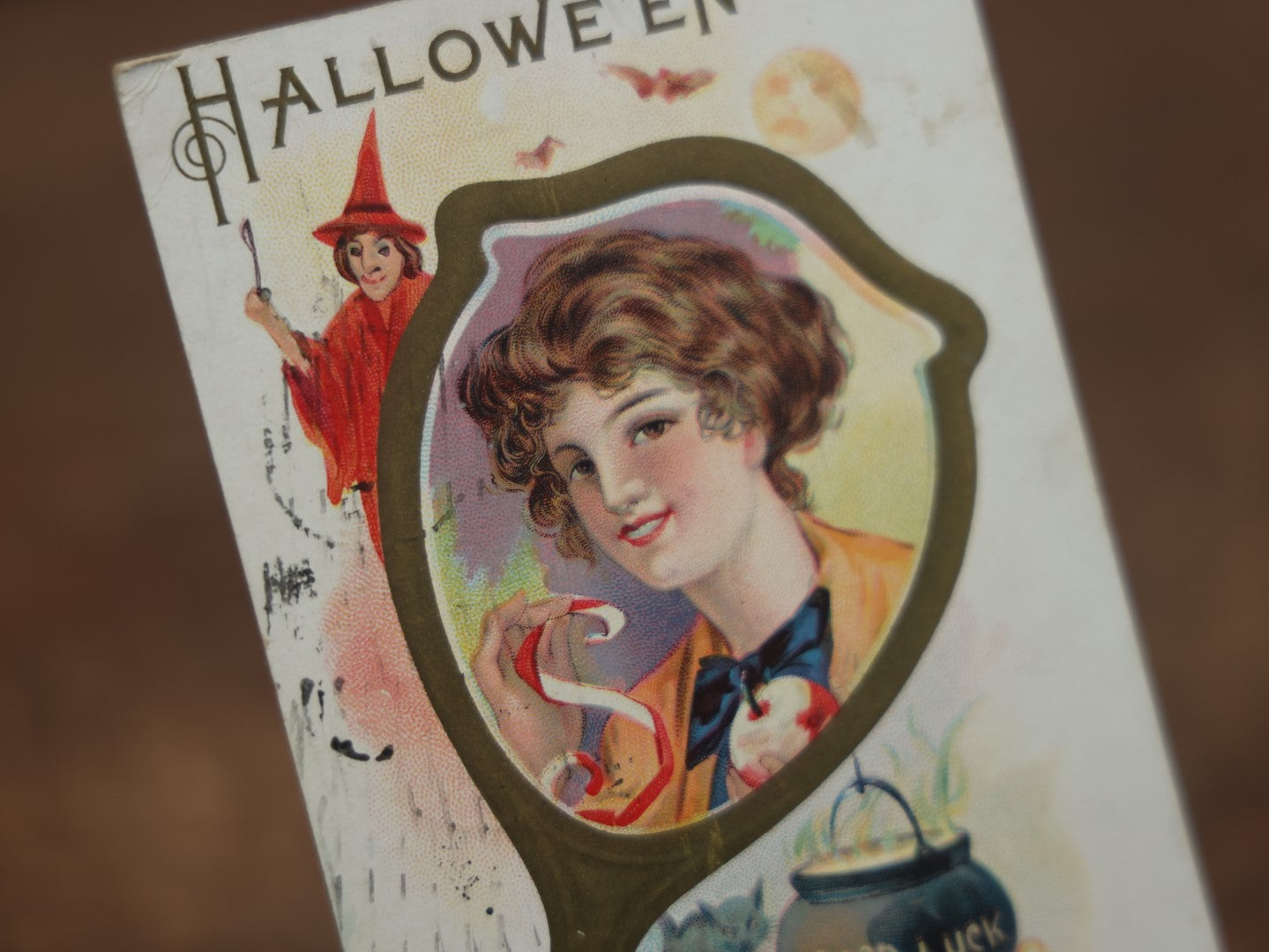 Lot 029 - Antique Embossed Halloween Postcard, Woman In Mirror With Apple, Red Witch, Black Cat, Good Luck Cauldron, Postmarked 1919, Writing On Back, Series 248D 