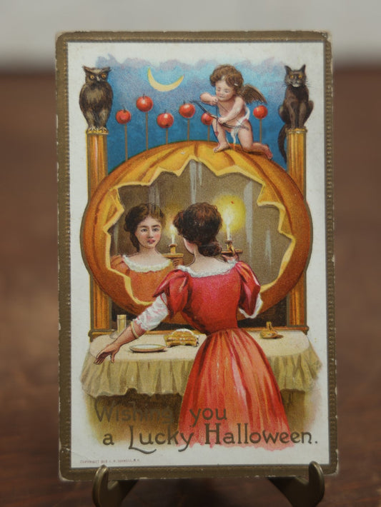 Lot 030 - Antique Embossed Halloween Postcard, "Wishing You A Lucky Halloween," Copyright 1910 By L.R. Conwell, Woman With Candle Looking In Pumpkin, Cupid, Black Cat, Owl, No Writing, Series 630