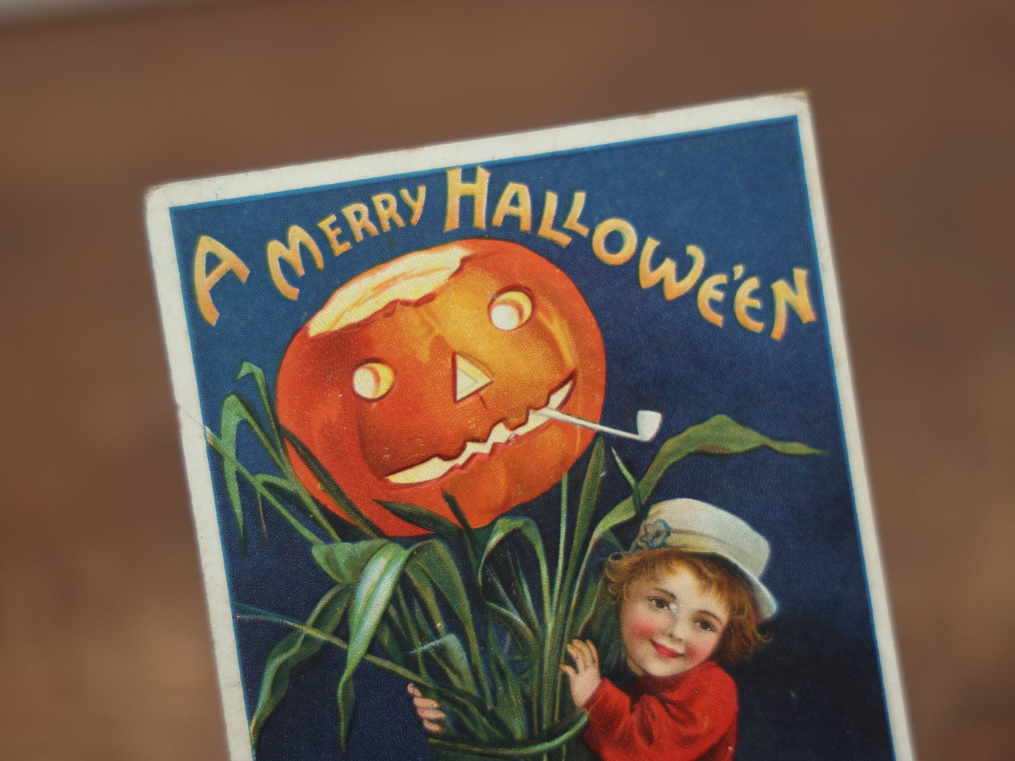 Lot 034 - Antique Embossed Halloween Postcard, Child On Stalk With Jack-O-Lantern Pumpkin, By Ellen Clapsaddle, "A Merry Halloween," Writing, Printed In Germany, International Art Publishing Company, Series No. 978