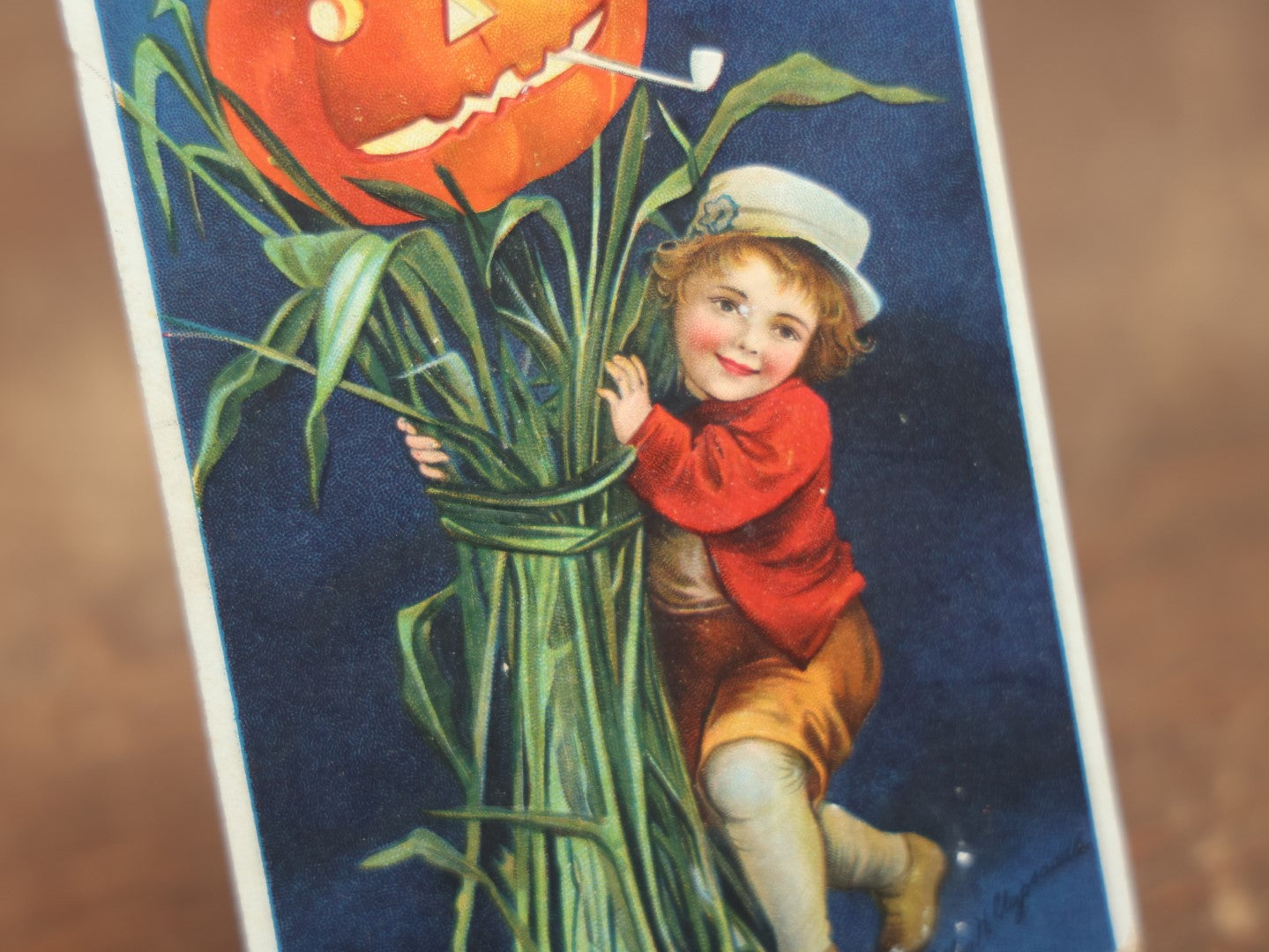 Lot 034 - Antique Embossed Halloween Postcard, Child On Stalk With Jack-O-Lantern Pumpkin, By Ellen Clapsaddle, "A Merry Halloween," Writing, Printed In Germany, International Art Publishing Company, Series No. 978