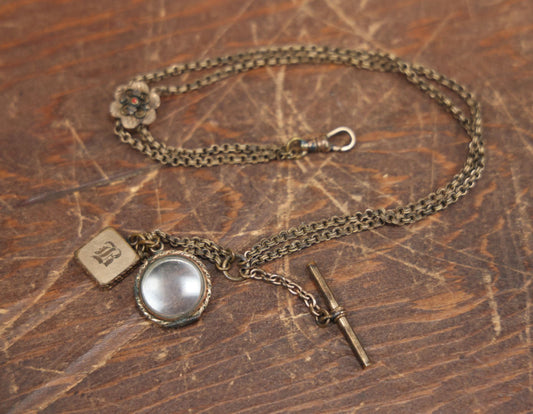 Lot 051 - Antique Watch Chain With Charms Including Square Monogrammed B Locket, Glass Windowed Piece