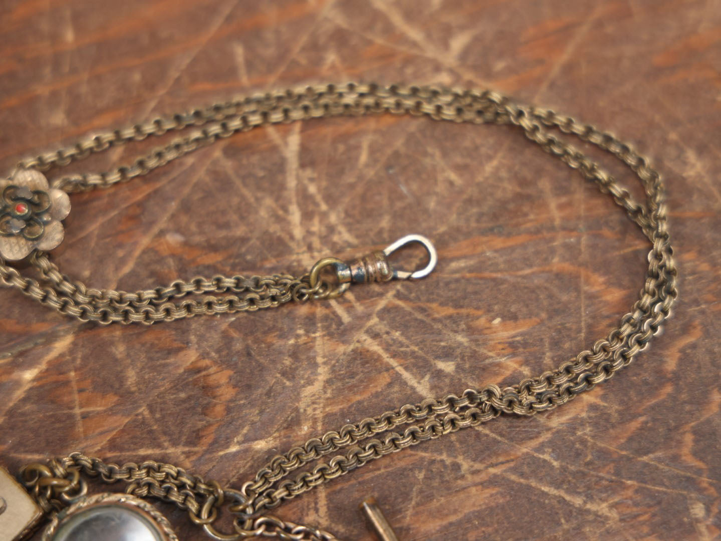 Lot 051 - Antique Watch Chain With Charms Including Square Monogrammed B Locket, Glass Windowed Piece