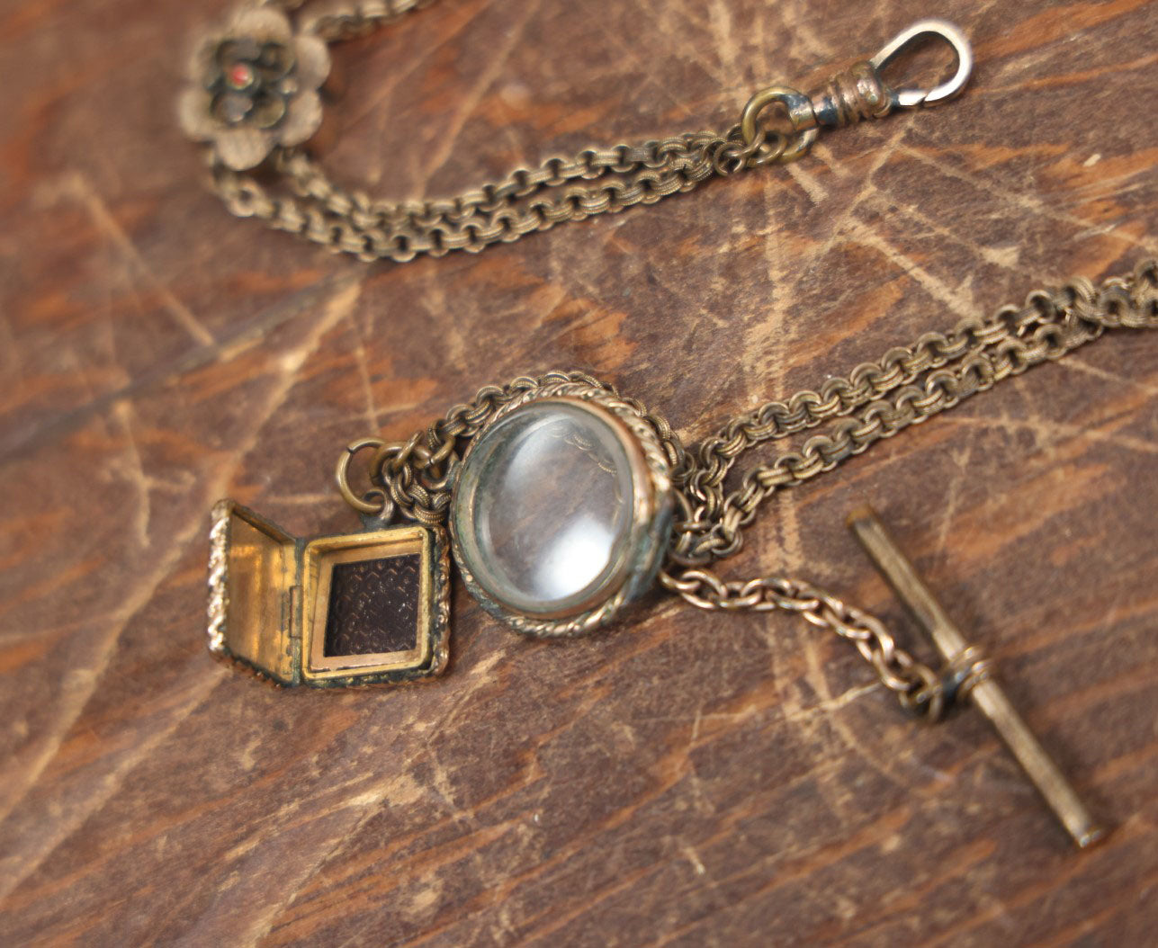 Lot 051 - Antique Watch Chain With Charms Including Square Monogrammed B Locket, Glass Windowed Piece