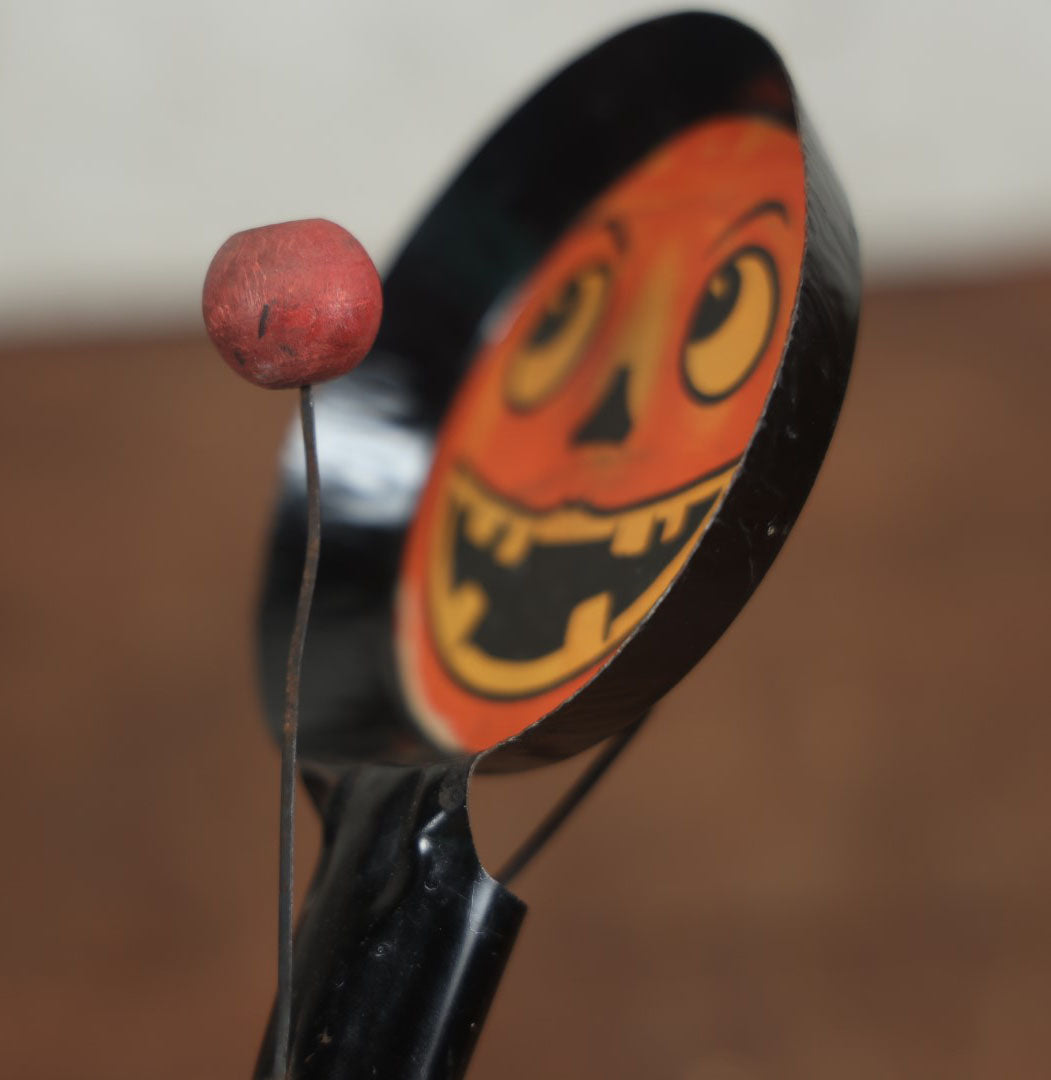 Lot 055 - Vintage Jack-O-Lantern Pumpkin Halloween Noisemaker With Printed Paper Face, Tin Body, Originally Also A Whistle, Missing One Ball, Note Damage