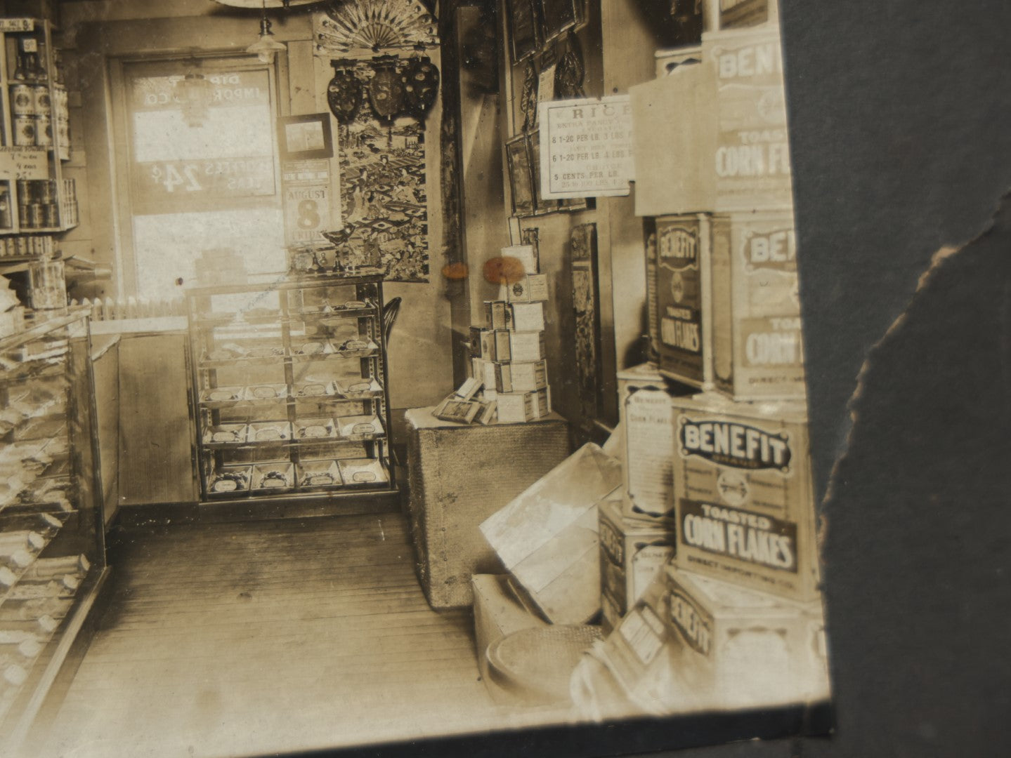 Lot 076 - Antique Boarded Occupational Photograph Of A Handsome Shopkeeper In A General Store, With Advertising, Chinese Lanterns With Tea Ads, And More, Note Bend In Corner