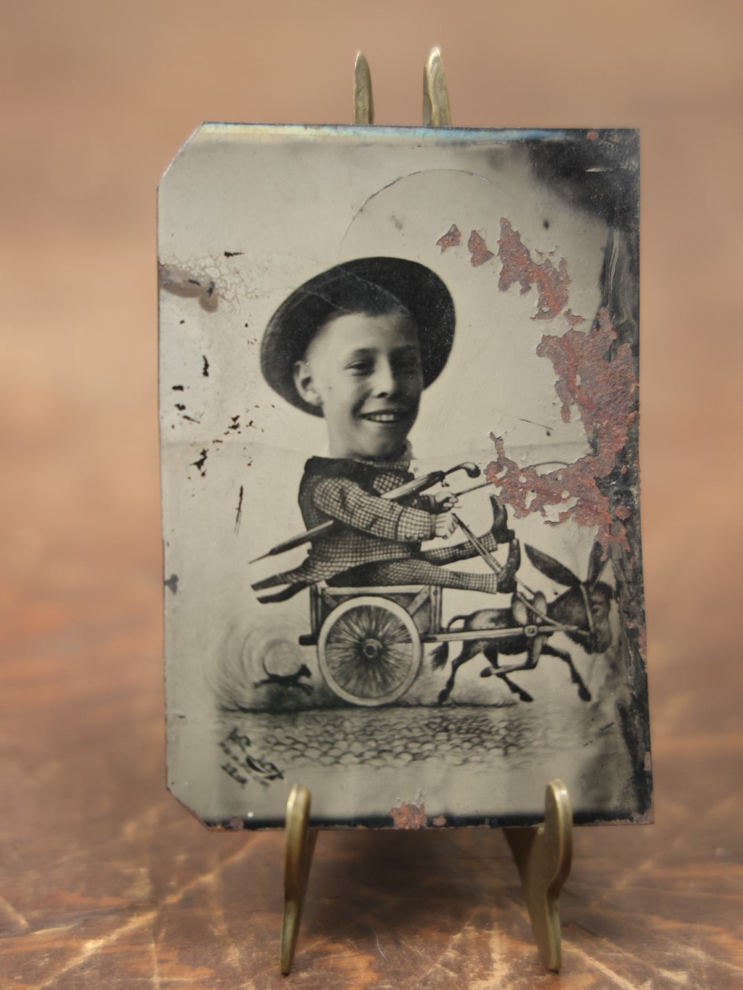 Lot 086 - Antique Single Tintype Photograph, Young Boy With Cartoon Body, In Cart Being Pulled By Donkey