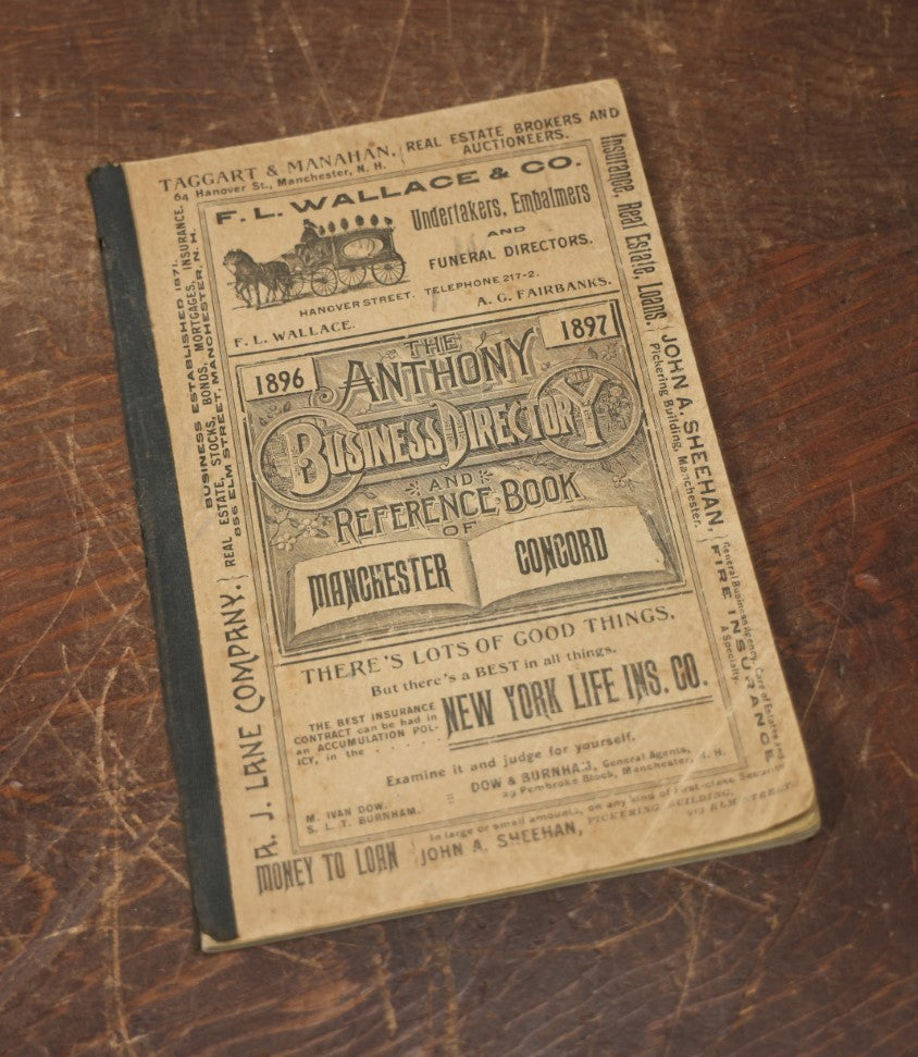 Lot 093 - Antique 1896-1897 Anthony Business Directory For Manchester And Concord, New Hampshire, With Advertisement For F.L. Wallace & Co., Undertakers, Embalmers, And Funeral Directors, With Horse Drawn Hearse On Cover