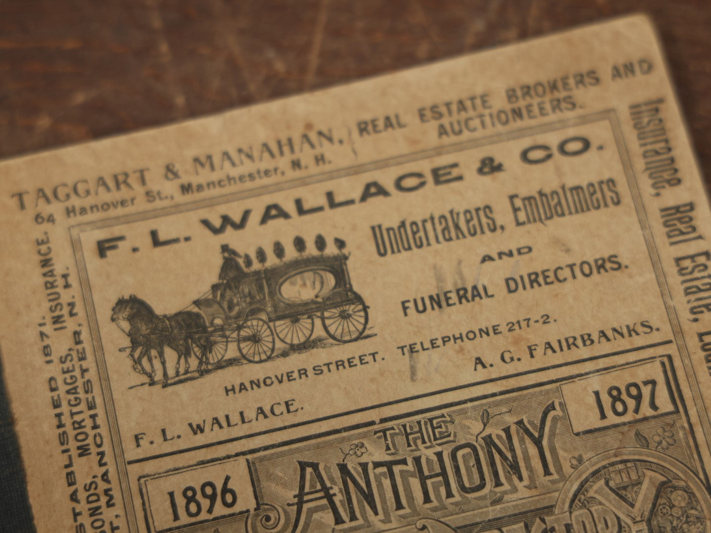 Lot 093 - Antique 1896-1897 Anthony Business Directory For Manchester And Concord, New Hampshire, With Advertisement For F.L. Wallace & Co., Undertakers, Embalmers, And Funeral Directors, With Horse Drawn Hearse On Cover