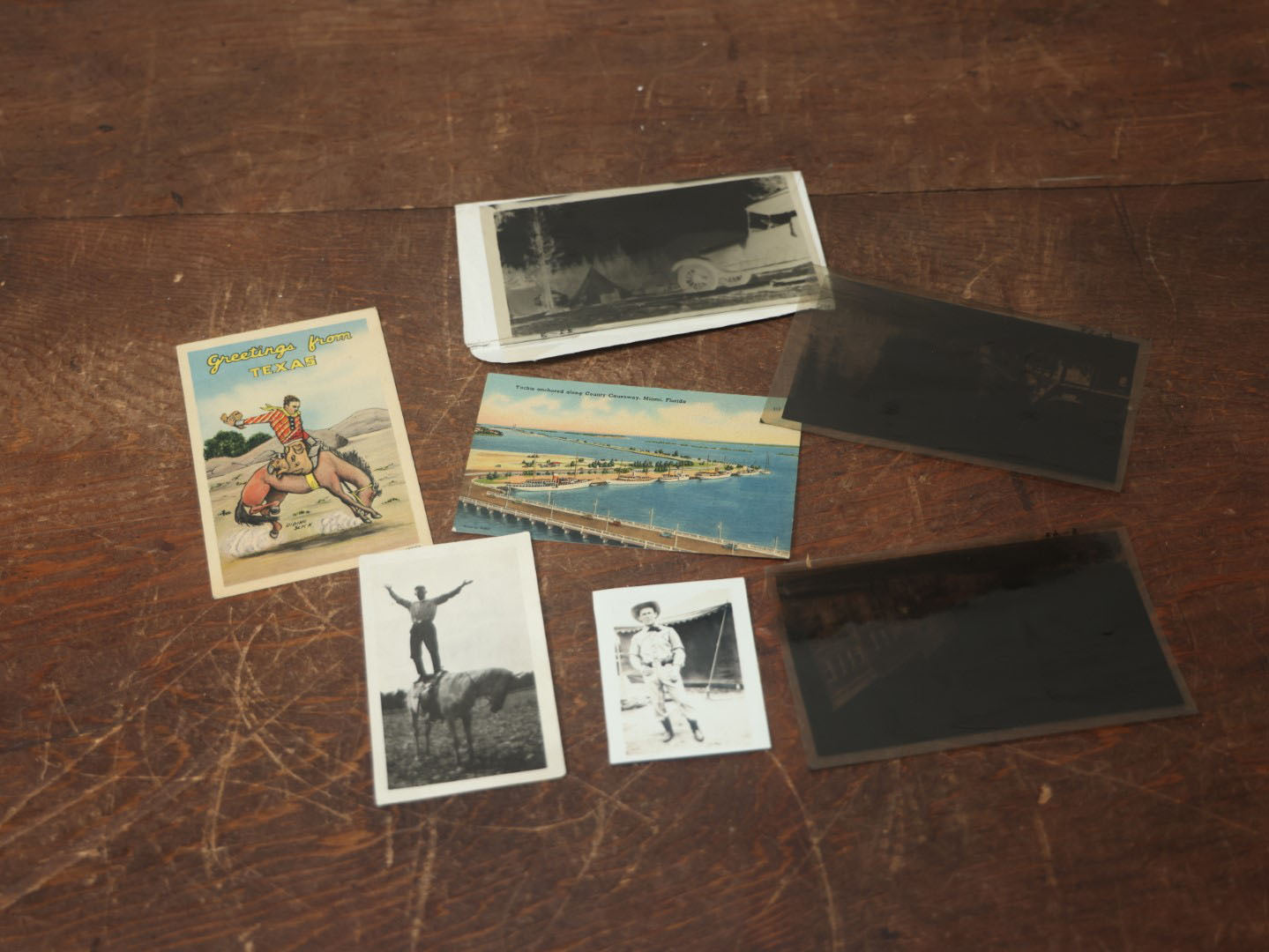 Lot 101 - Misc. Ephemera Grouping With Three Postcards, Including Texas, Two Snapshots Of Cowboys, And Three Negatives Of Interesting Scenes, Old West