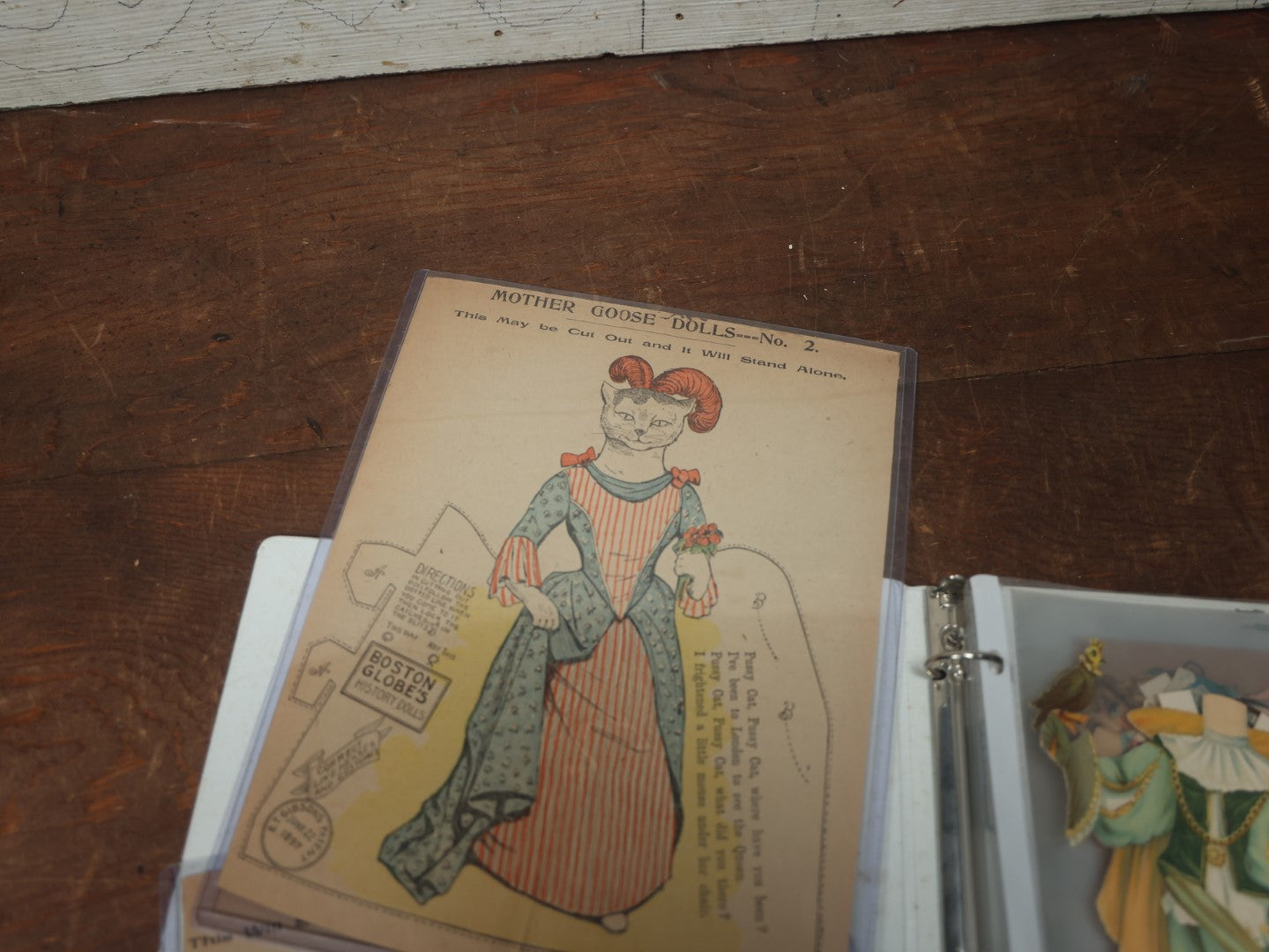 Lot 102 - Large Grouping Of Paper Dolls In Binder, Including Dolls And Outfits By Raphael Tuck & Sons