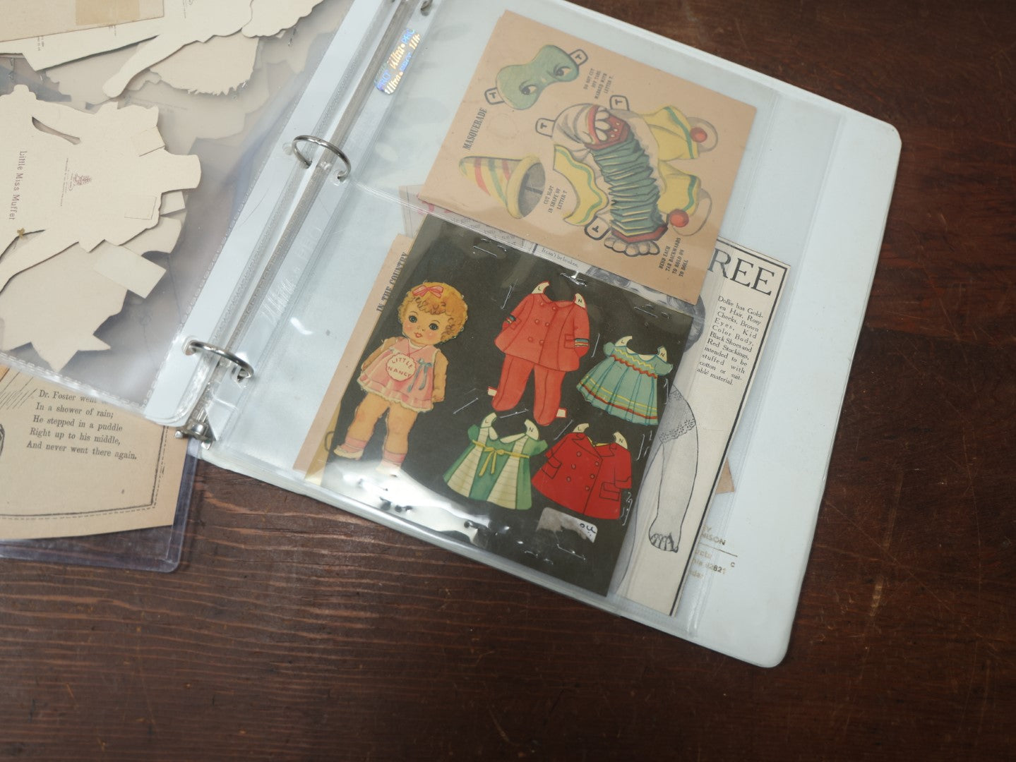 Lot 102 - Large Grouping Of Paper Dolls In Binder, Including Dolls And Outfits By Raphael Tuck & Sons