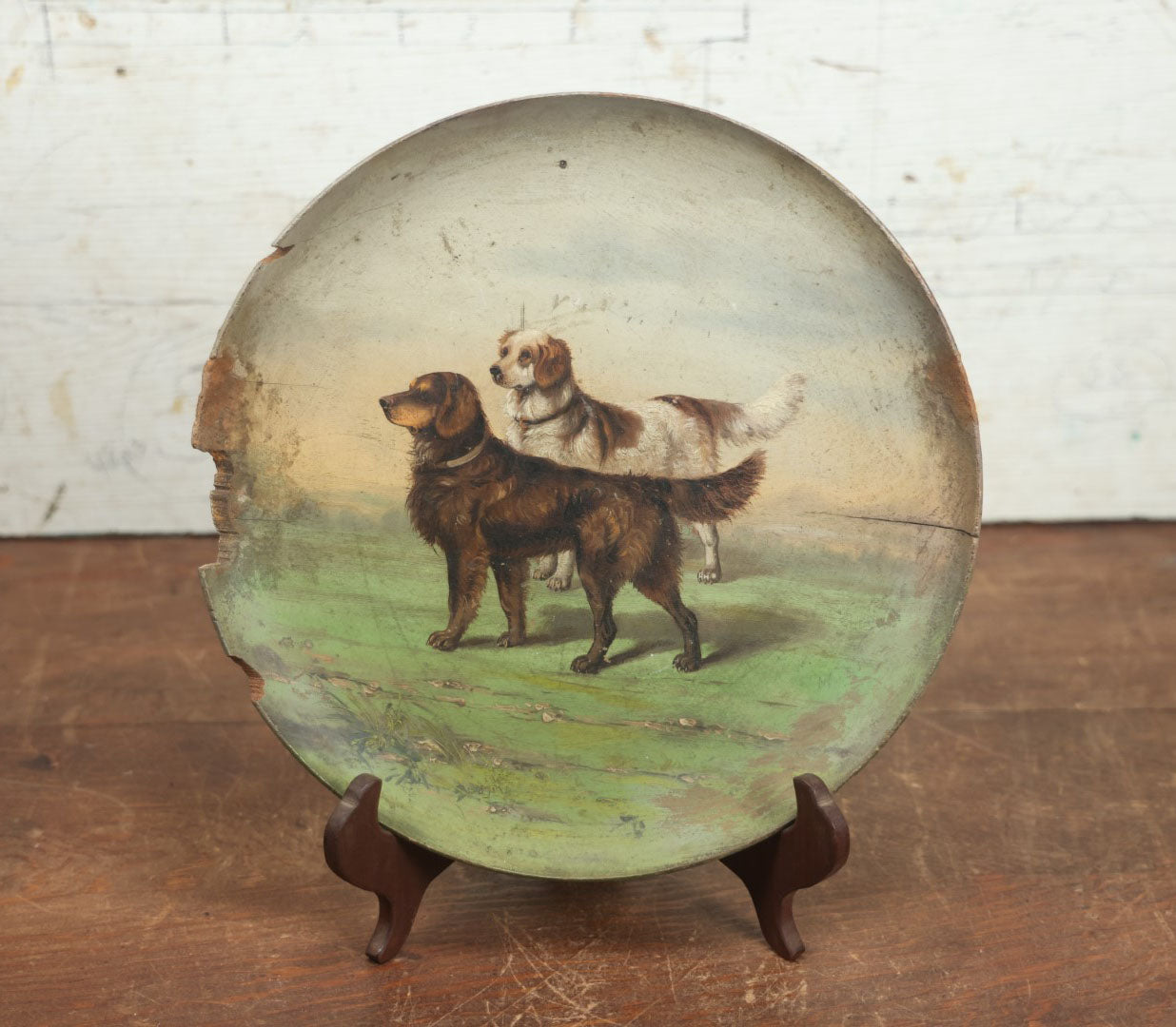 Lot 011 - Antique Painting On Shallow Wood Plate Of Two Dogs, Note Losses To Wood And Paint, Circa 1890, Likely By Nellie Weise