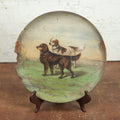 Lot 011 - Antique Painting On Shallow Wood Plate Of Two Dogs, Note Losses To Wood And Paint, Circa 1890, Likely By Nellie Weise